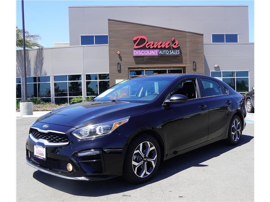 2021 Kia Forte LXS in Aurora Black — front three-quarter view