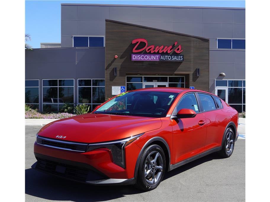 2025 Kia K4 LXS in Currant Red — front three-quarter view