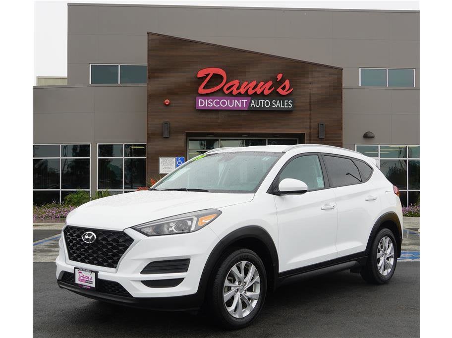 2019 Hyundai Tucson Value in Dazzling White — front three-quarter view